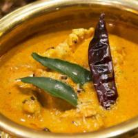 Chicken Madras · Chunks of chicken tempered with mustard seeds, curry leaves and finished with coconut milk.