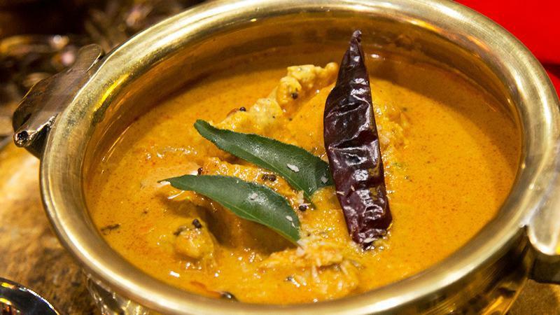 Chicken Madras · Chunks of chicken tempered with mustard seeds, curry leaves and finished with coconut milk.