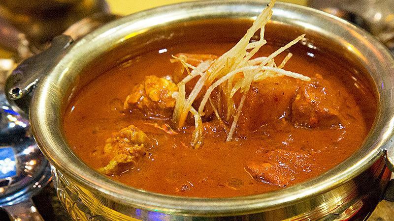 Chicken Vindaloo · Chunks of chicken cooked with potatoes in a tangy sauce.