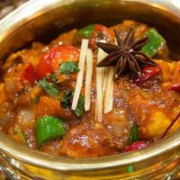 Chicken Jalfrezi · Chunks of chicken cooked with stir-fried onions and bell peppers in a classic curry sauce.