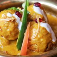 Nilgiri Coco-Kabab Curry · Chicken meatballs cooked in rich and creamy Bombay chowk signature gravy.