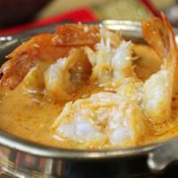 Shrimp Machli Moilee · Shrimp simmered in chive malai, curry leaves, mustard seeds, and lemon juice.