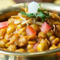 Chana Masala · Yellow chickpeas cook with home ground spices.