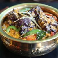 Hydrabadi Bagara Baingan · Baby eggplants with piquant chilies cooked into a thick roasted coconut gravy.