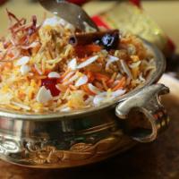 Murge Yakhani (Chicken) Biryani · Steamed boneless chicken encrusted with biryani rice.
