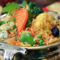 Subzi Biryani · Fresh vegetables cooked with biryani rice flavored with mace, cardamom, and saffron.