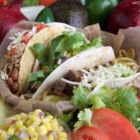 Steak Nachos · Steak, tortilla chip, cheese, re-fried beans, pico de gallo and sour cream.