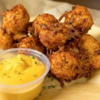 Pub Cheddar Tots · Made from scratch! Tater‑tots stuffed with sharp cheddar cheese. Served with our homemade ch...