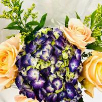 Peach Roses Bouquet · Peach roses and purple hydrangea. Lovely combination of colors!!
Color of flowers may vary.