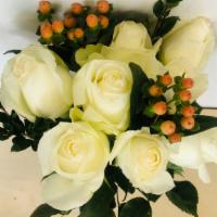 White Roses Bouquet · White roses and baby breath.