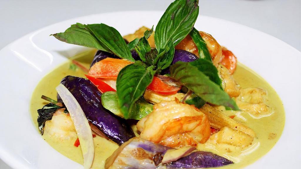 Green Curry Thai Entrée · Hot and spicy. Red onion, bell pepper, baby corn, eggplant, fried tofu, and basil cooked with coconut milk.