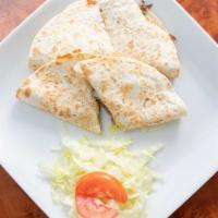 14) Quesadillas (2) · Tortillas folded and stuffed with cheese, and the meat of your choice: chicken, beef, tinga.