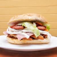 12) Tortas · Mexican style sandwich with lettuce, mayo, sausage, ham, eggs, cheese and the choice of your...