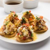Papdi Chaat · Crushed crispy shell with tangy combination of potatoes, chickpeas, onions, yogurt, mint and...