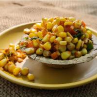 Moghlai Corn · Corn kernels sauteed with finely chopped onion, green peppers, ginger and tossed with Indian...