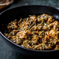 Lamb Saag · Finely chopped garden fresh spinach cooked with lamb in an authentic spicy Indian herb sauce.