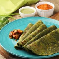 Palak Roomali Roti · Handkerchief bread cooked on a dome shaped griddle.