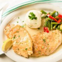 Pollo Alla Francese · Breast of chicken lightly battered with egg, sautéed in a white wine and lemon sauce, served...