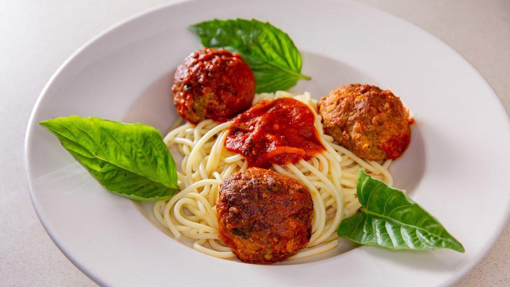 Spaghetti & Meatballs · Spaghetti pasta with hand rolled homemade seasoned beef, pork & veal meatballs in a light tomato sauce.