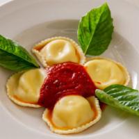Ravioli · Ravioli stuffed with ricotta cheese, served in a light tomato or spicy fra diavolo sauce.
