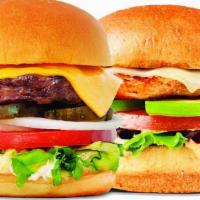 Duo Burger · Two burgers. Includes Roma tomato, leaf lettuce, shaved onions, pickles, American cheese, an...