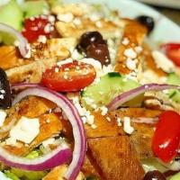 Greek Salad · Romaine, feta, cucumber, croutons, red onion, grape tomatoes, Kalamata olives and lemon vina...