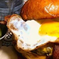 Bacon Egg And Cheese Burger · Thick cut bacon, fried egg, American cheese and a brioche bun. Served medium well.