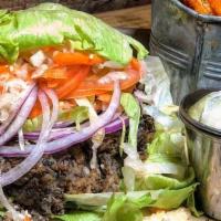 Screamin Black Bean Burger · Vegan with lettuce wrap. House-made vegetarian black bean and brown rice patty, shredded let...