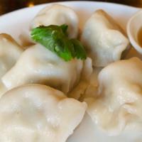 Boiled Dumplings With Pork, Shrimp And Chives - 6 Pcs · Boiled Dumplings with Pork, Shrimp and Chives serve with dumplings sauce.