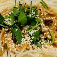 Cold Sesame Noodles · Noodles with Peanut sauce, sesame oil mix with scallion and cucumber strips on top.