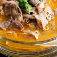 Fatty Beef In Sour Cabbage Broth · Spicy broth with sliced fatty beef.