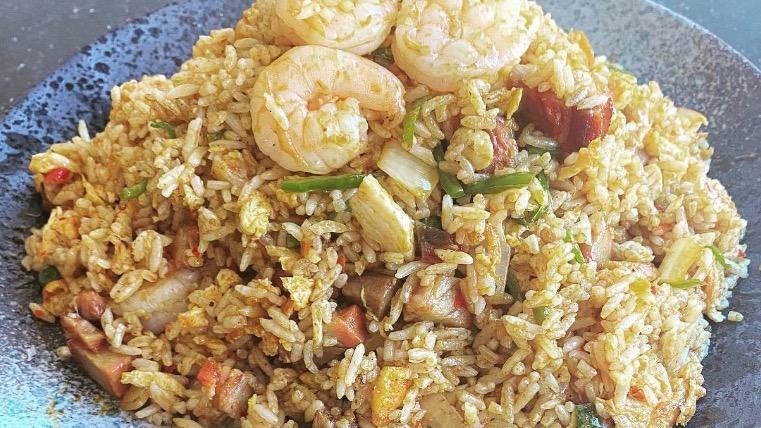 Singapore Fried Rice · Fried rice with shrimp, roast pork, chicken in curry powder. Spicy.