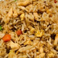 Fried Rice With Chicken · Prepared steamed white rice, soy sauce, eggs, peas, carrots and green onions.