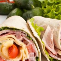 Canadian Wrap · Delicious breakfast wrap made with Fresh Turkey, Eggs, Spinach and Melted Cheddar.