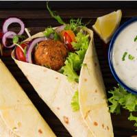 Falafel Wrap · Delicious breakfast wrap made with Falafel, Lettuce, Tomatoes, and Customer's choice of sauce.