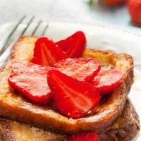 French Toast With Strawberries · Delicious, hot French Toast cooked to perfection. Topped with fresh strawberries.