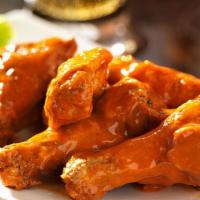 Buffalo Chicken Wings · 6 pieces of Buffalo Chicken wings fried to perfection.