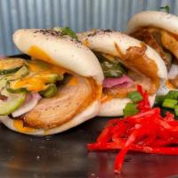 Chashu Pork Bao Buns • · Soft Sandwich Buns (3pcs), Chashu Pork, Pickled Vegetables, Scallions, Spicy Mayo, & Sesame ...