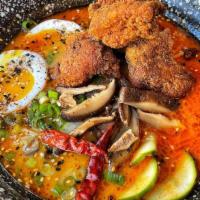 Tan Tan Spicy Ramen • · Spicy Sesame Broth, Crispy Chicken, Shiitake Mushrooms, Soft Egg, Pickled Cucumbers, Scallio...