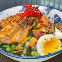 Chashu Pork Rice Bowl · soft egg, roasted corn, pickled daikon, pickled cucumbers, pickled red onions, pickled ginge...