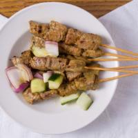A5 Satay Beef 沙爹牛 (6 Skewers) · Marinated beef satay (skewers) served with cucumbers, red onions and peanut sauce on the sid...
