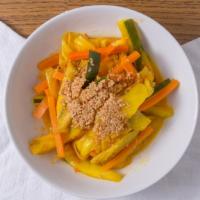 A13 Achat 亞紮 · Spicy. Mildly spicy pickled vegetable salad served with crumbled peanuts is the perfect comp...