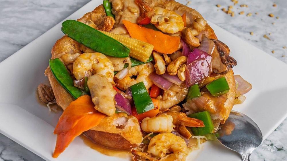 C7 Sarang Burong 佛砵飄香 · Fried taro stuffed with shrimp, chicken, corn, snow peas & black mushroom topped with cashew nuts.