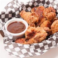 Bbq Chicken Wings · Freshly made chicken wings smothered in savory BBQ sauce and served with a side of ranch dip.
