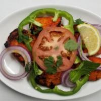 Afghan Chef Special House Salad · Served with fresh-cut salad. House dressing and naan bread.