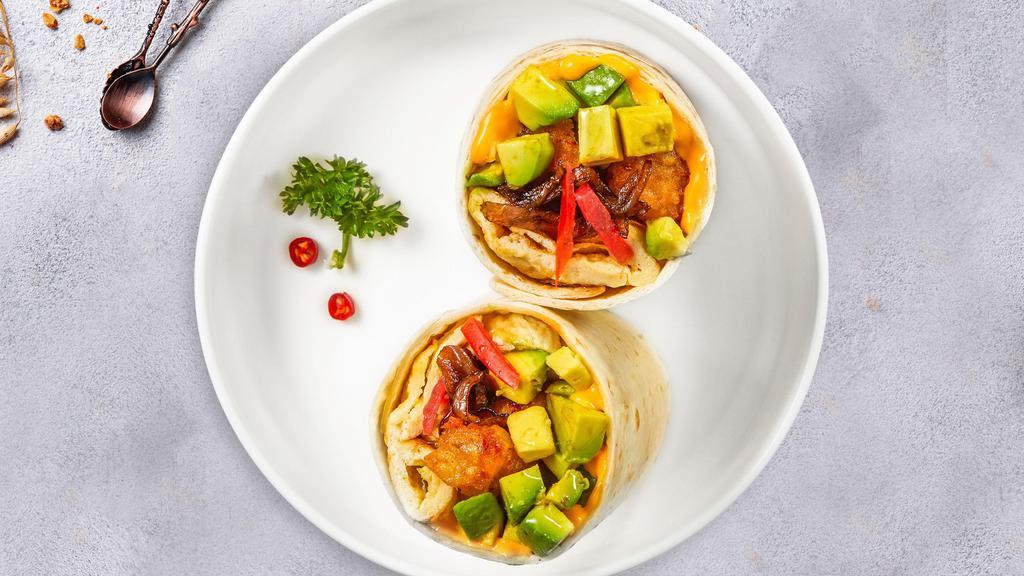 Avolicious · Avocado, eggs, cheddar cheese, tomatoes and onions wrapped in a flour tortilla.