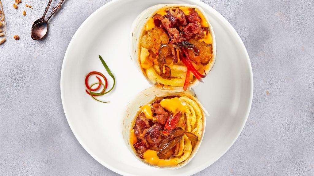 Don'T Go Bacon My Heart · Bacon, eggs, cheddar cheese, tomatoes and onions wrapped in a flour tortilla.