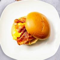 Bacon, Egg, And Cheese Sandwich · Scrambled egg, bacon, and cheddar cheese served on a bread.