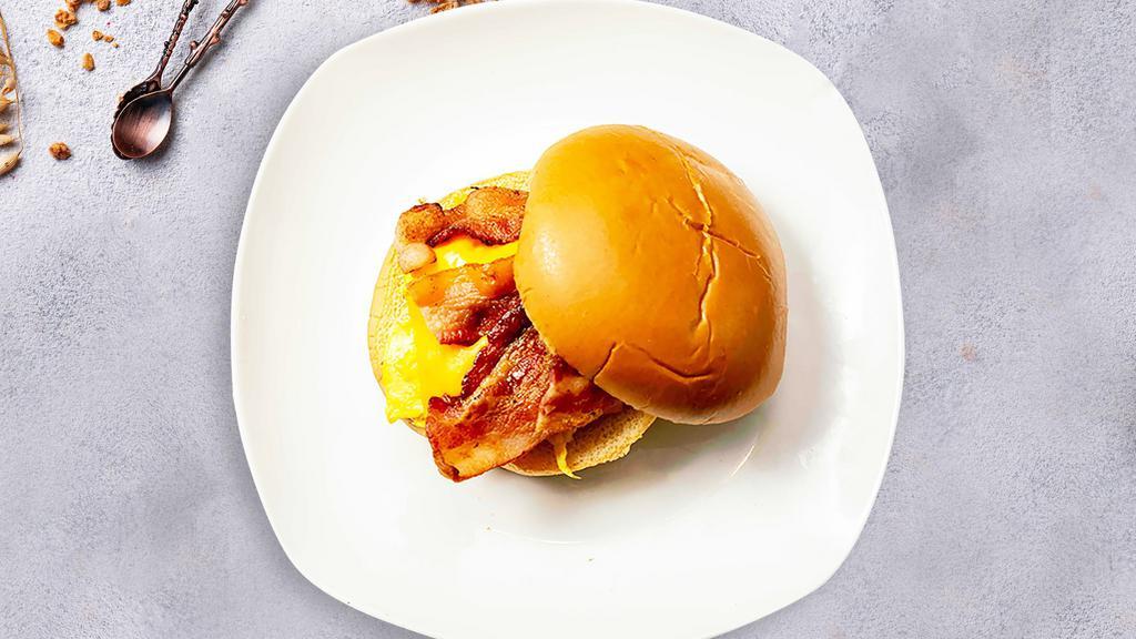 Bacon, Egg, And Cheese Sandwich · Scrambled egg, bacon, and cheddar cheese served on a bread.
