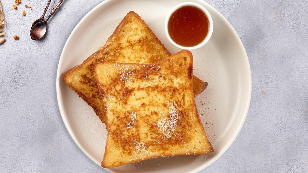 French Toast · Fresh bread battered in egg, milk, and cinnamon cooked until spongy and golden brown. Topped with powdered sugar, and served maple syrup.